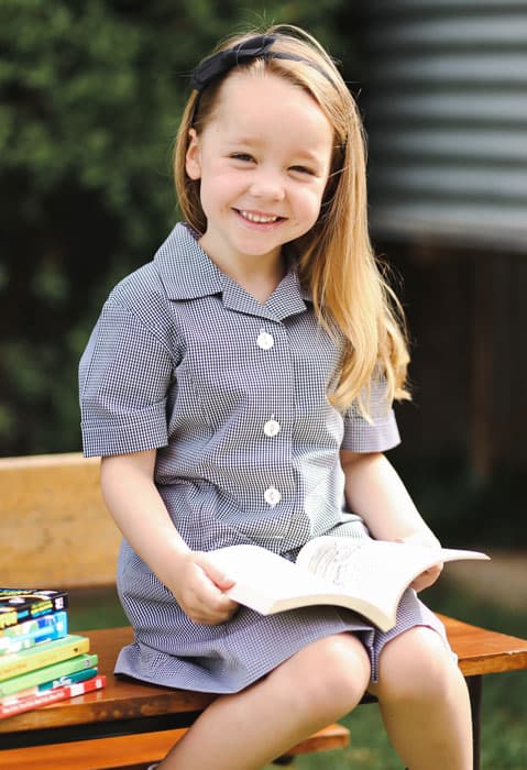 Kindergarten child enjoying learning to read.
