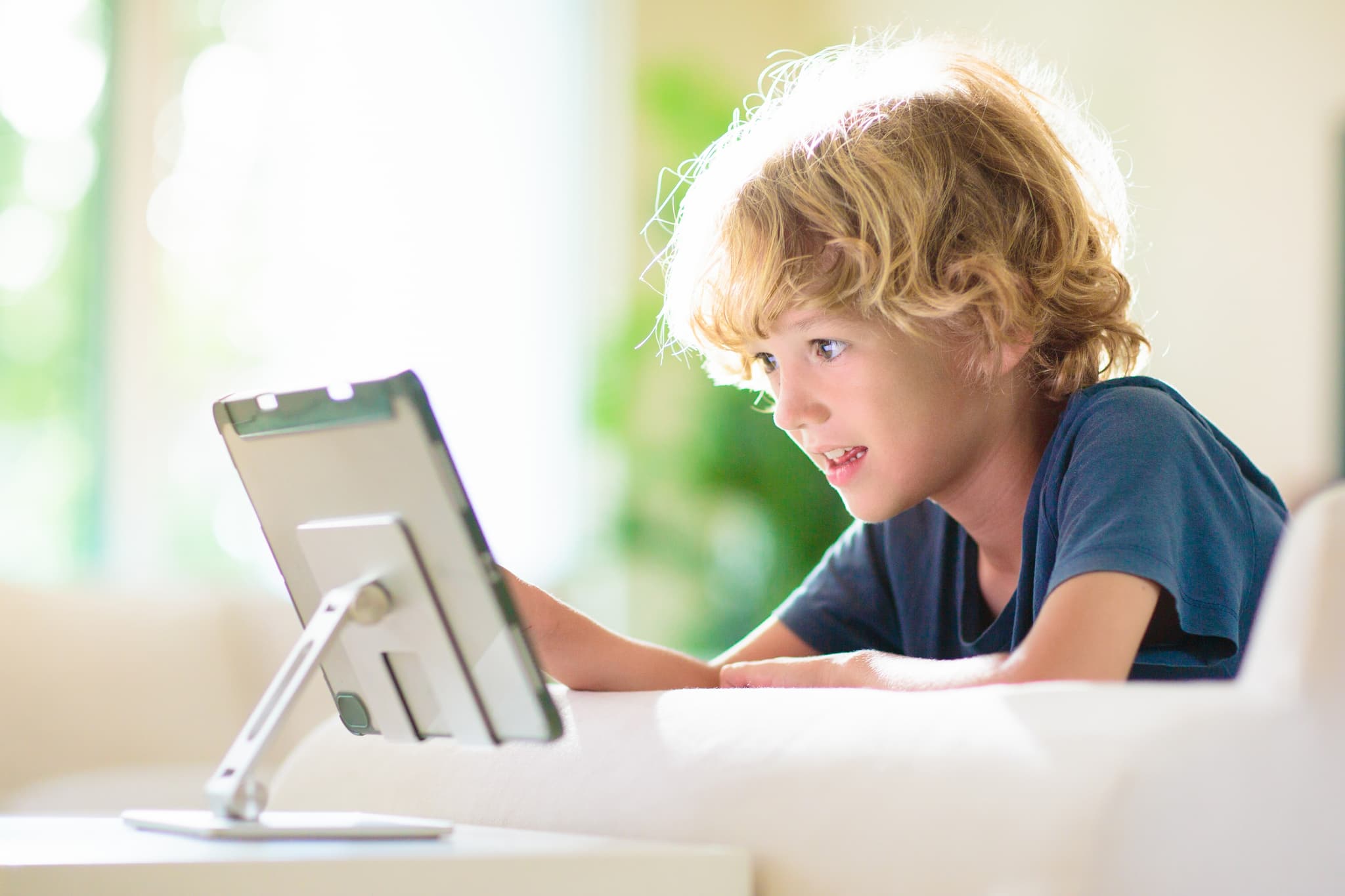 Smiling child building reading confidence in supportive learning environment